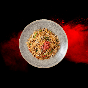 Yaki Soba Chicken + Prawn from Wagamama menus and prices 2025, with stir-fried soba noodles, chicken, prawns, and vegetables.