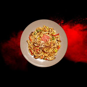 Yaki Udon from Wagamama menus and prices 2025, featuring thick udon noodles stir-fried with vegetables, protein, and savory sauce.